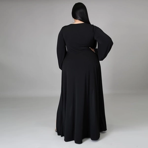 Back view of a black long sleeve plus size maxi dress with an elegant flowing hemline
