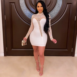 Elegant white bodycon mini dress with sheer mesh panels and sparkling silver rhinestones