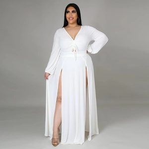 Detailed view of white plus size maxi dress with deep V-neck and high front double slits