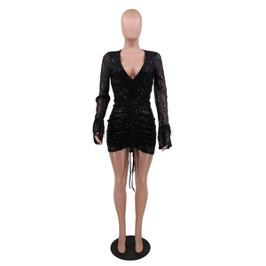 Detail of V-neck sequined dress featuring elegant feather cuffs and ruched drawstring texture