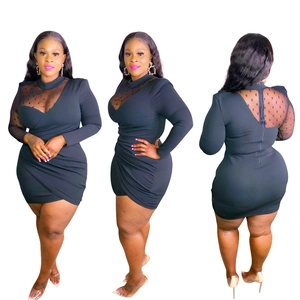Detail view of black bodycon dress featuring sheer polka dot mesh sleeves and ruched skirt