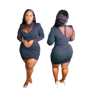 Detail view of black bodycon dress with polka dot mesh sleeves and back zipper closure