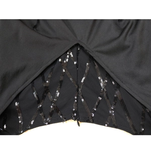 Detail of black dress featuring sequined mesh diamond pattern and invisible zipper