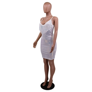 Detailed view of white sequined bodycon dress featuring elegant long fringe trim at the bust