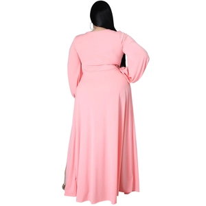 Back view of pink long sleeve maxi dress showing draped fabric and lantern sleeve details