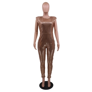 Macro detail of rose gold sequin fabric on sleeveless jumpsuit for evening party