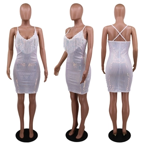 Three-way view of white sequin dress with fringe details and lace-up back design