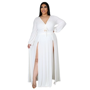 Elegant white long sleeve plus size maxi dress with deep V-neck and high side slits