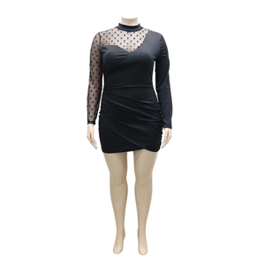 Detail of ruched black bodycon dress with sheer polka dot mesh neckline and sleeves
