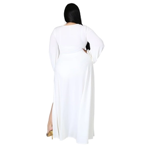 Detailed back view of a white V-neck dress featuring a high side slit and long sleeves