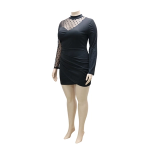 Detail of plus size black dress with polka dot mesh sleeves and ruched side detail