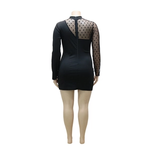 Detail of slim fit mini dress featuring black polka dot mesh sleeve and back splicing