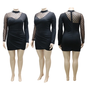 Plus size black bodycon dress with polka dot mesh sleeves and ruched front design