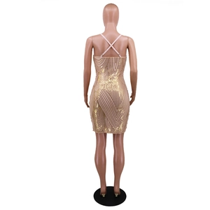 Detail of cross back straps and golden sequin wave patterns on a bodycon party dress