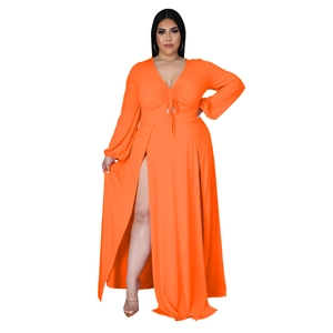 Detail of V-neck orange maxi dress with drawstring ruched bust and high double slits