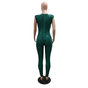 Detail of deep green sequin jumpsuit back view featuring a smooth metal zipper closure