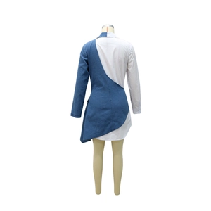 Detail of asymmetrical denim and white shirt fabric patchwork on the back of the dress