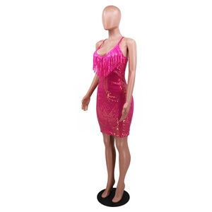 Detail of rose red sequin dress with gold V-shaped patterns and matching long fringe trim