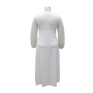 Rear view of white long-sleeved midi dress featuring a cinched waist and pleated back detail
