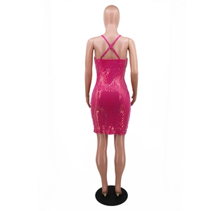 Detail of rose red sequin dress with gold wavy patterns and crisscross back straps