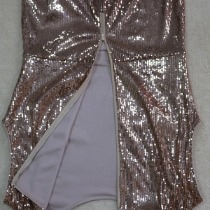 Detailed view of the rose gold sequin dress featuring a semi-open invisible back zipper