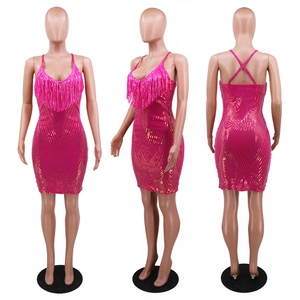 Front side and back views of a hot pink sequined fringe dress with gold wave patterns