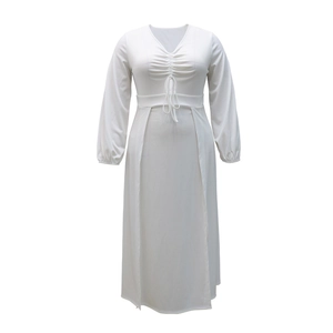 Detail of V-neckline with drawstring ties and ruched fabric on a white maxi dress