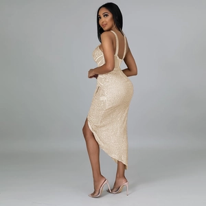 Detail of sequin gold party dress with slim fit, thin straps and high asymmetric side slit