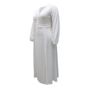 Detail of white V-neck maxi dress with drawstring ruched front and long sleeves