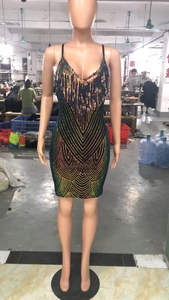 Detail of deep V-neck sequins and colorful fringe on a bodycon party dress for women