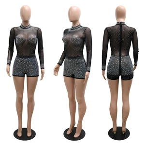 Detail of sheer mesh romper featuring silver rhinestones and a back zipper closure