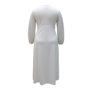 Back view of a white long sleeve maxi dress featuring high waist and flowy A-line skirt