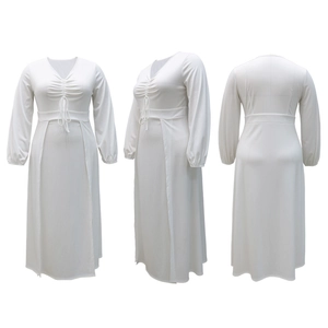 Detail view of white V-neck dress with adjustable drawstring and waist belt details