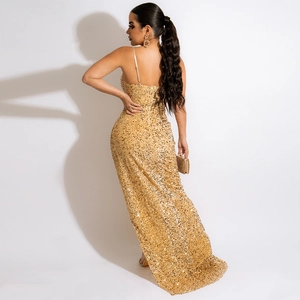 Detailed back view of gold sequin evening gown showing slit and shimmering metallic texture