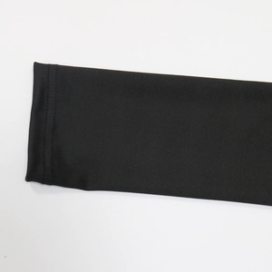 Macro detail of high-quality double-needle stitching on black elastic mesh fabric sleeve