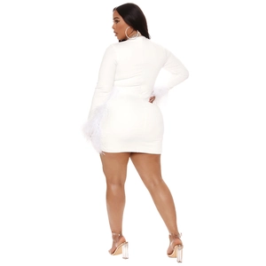 Detail view of the white long-sleeved mini dress featuring elegant feather-trimmed cuffs
