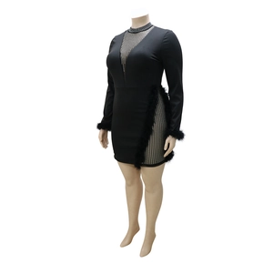 Detail of plus size black party dress with rhinestone mesh and faux fur trim sleeves