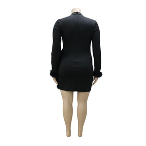 Detail view showing the back of a black bodycon dress with faux fur trim and rhinestone neck