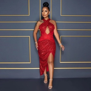 Detailed view of red sequin evening dress with cross neck and waist cutout features