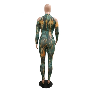 Back view of long sleeve mesh jumpsuit with cold shoulder cutouts and abstract tie-dye print