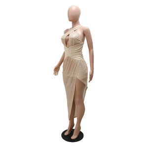 Detail of champagne sequin dress featuring cross halter neck and waist pleats