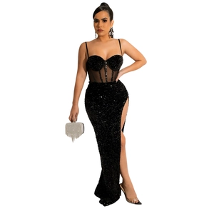 Detail of black sequined evening dress with mesh corset waist and high slit design
