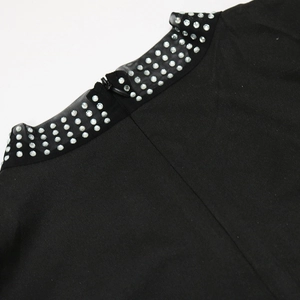 Detail of black dress collar with mesh patchwork, silver rhinestones, and back hidden zipper