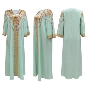 Three-view display of mint green long kaftan dress with ethnic floral prints on white background