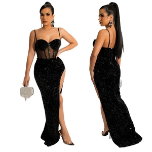 Detail of sexy black sequin evening gown with corset bodice and high side slit design