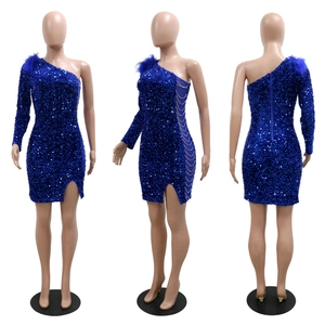 Detail of dark blue sequin mini dress with feather shoulder and metal chain cutout