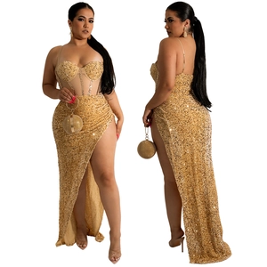 Detailed look at gold sequined formal set with thigh-high slit and matching clutch bag