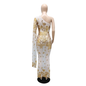 Detail of white mesh dress with gold sequin floral embroidery and asymmetric one-shoulder cut