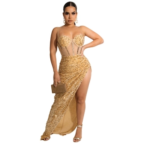 Golden sequin evening gown with corset bodice and high slit featuring matching clutch