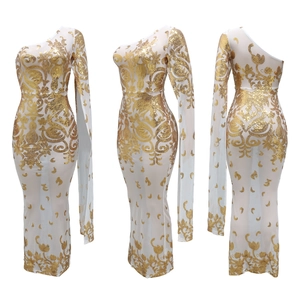 Detail of white mesh one-shoulder maxi dress featuring gold sequin baroque embroidery